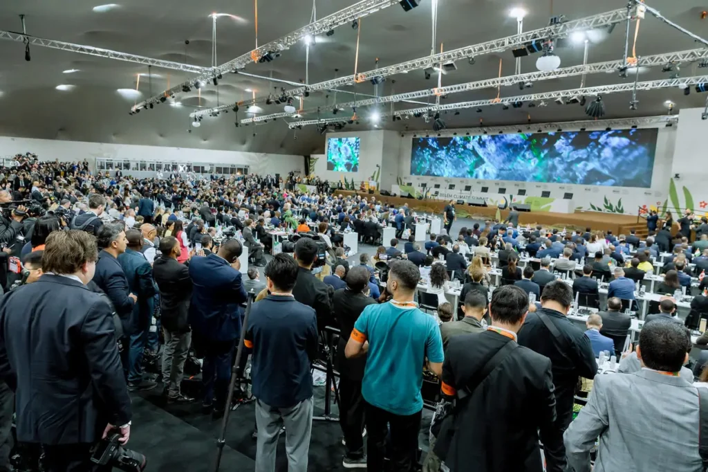 Delegates and observers gathered inside a large COP30 plenary hall during the Belém Climate Summit